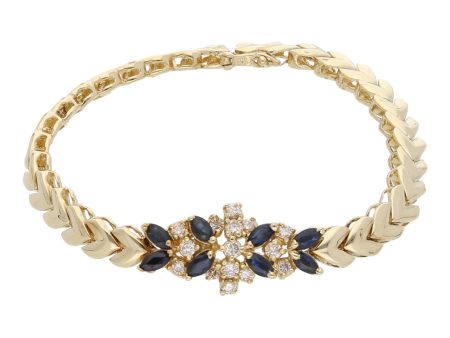 Pulsera estilizada con diamantes y zafiros en oro amarillo 14 kilates. Cheap